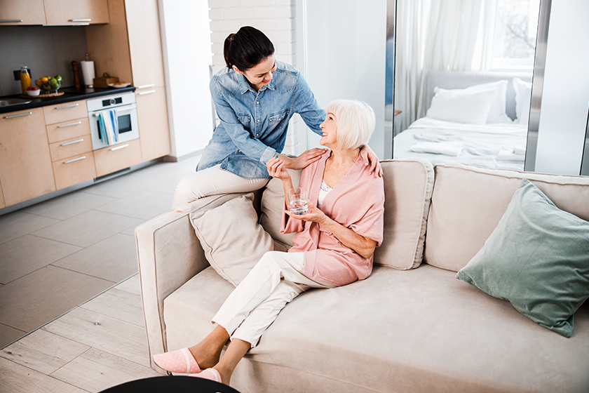 old-lady-taking-pills-and-spending-time-with-granddaughter