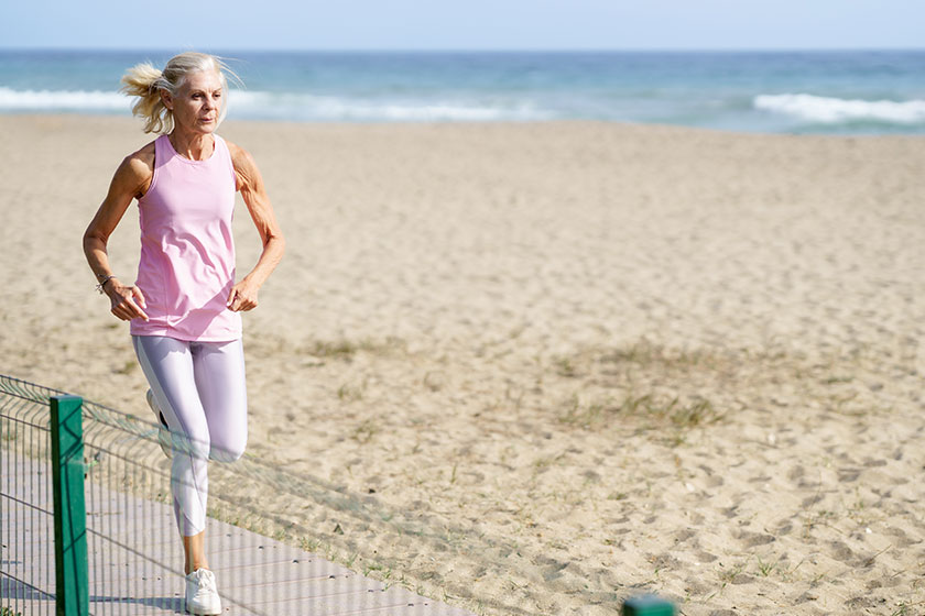 Older female doing sport to keep fit.