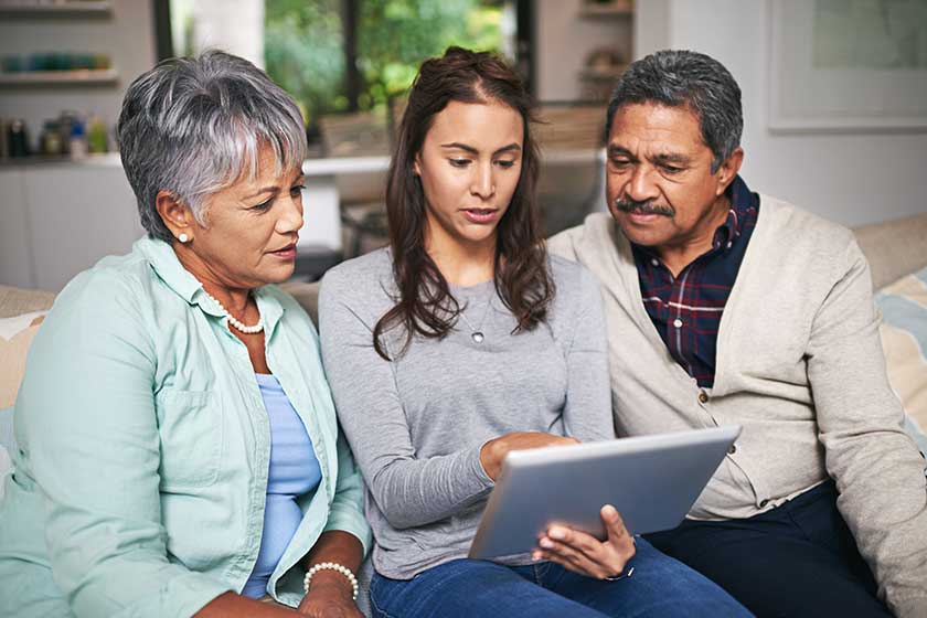 Senior parent, woman and tablet in living room for connection or bonding with technology.
