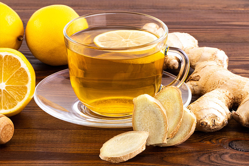 Cup of Ginger tea with lemon, honey and ginger root