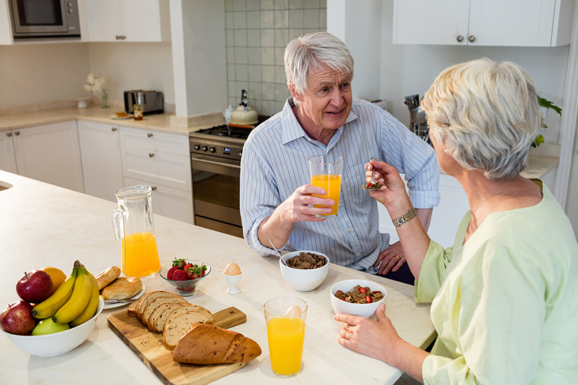 Senior couple having breakfast together