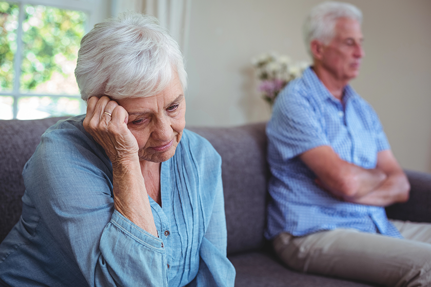 senior-woman-sitting-on-sofa