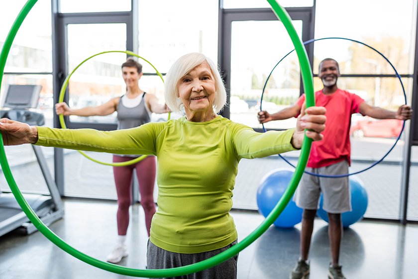 senior-woman-smiling-camera-while-training